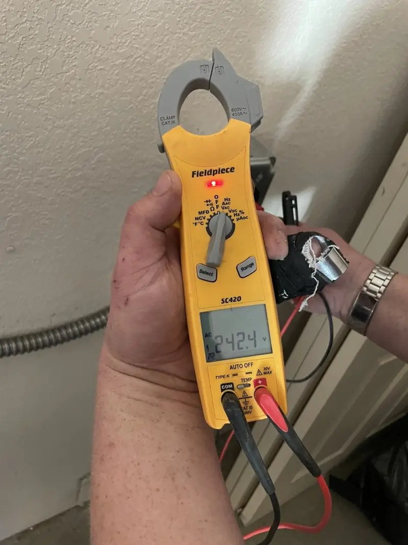 Voltage testing with clamp meter during Generator Installation in Beverly Hills